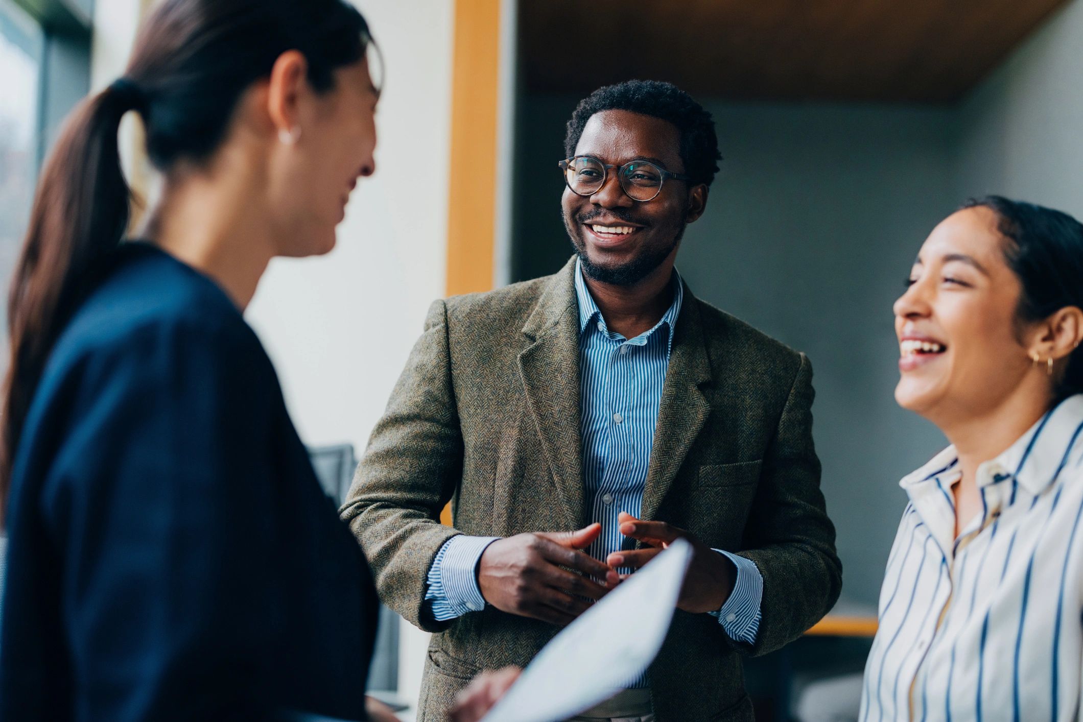 African American professionals collaborating in a diverse team meeting