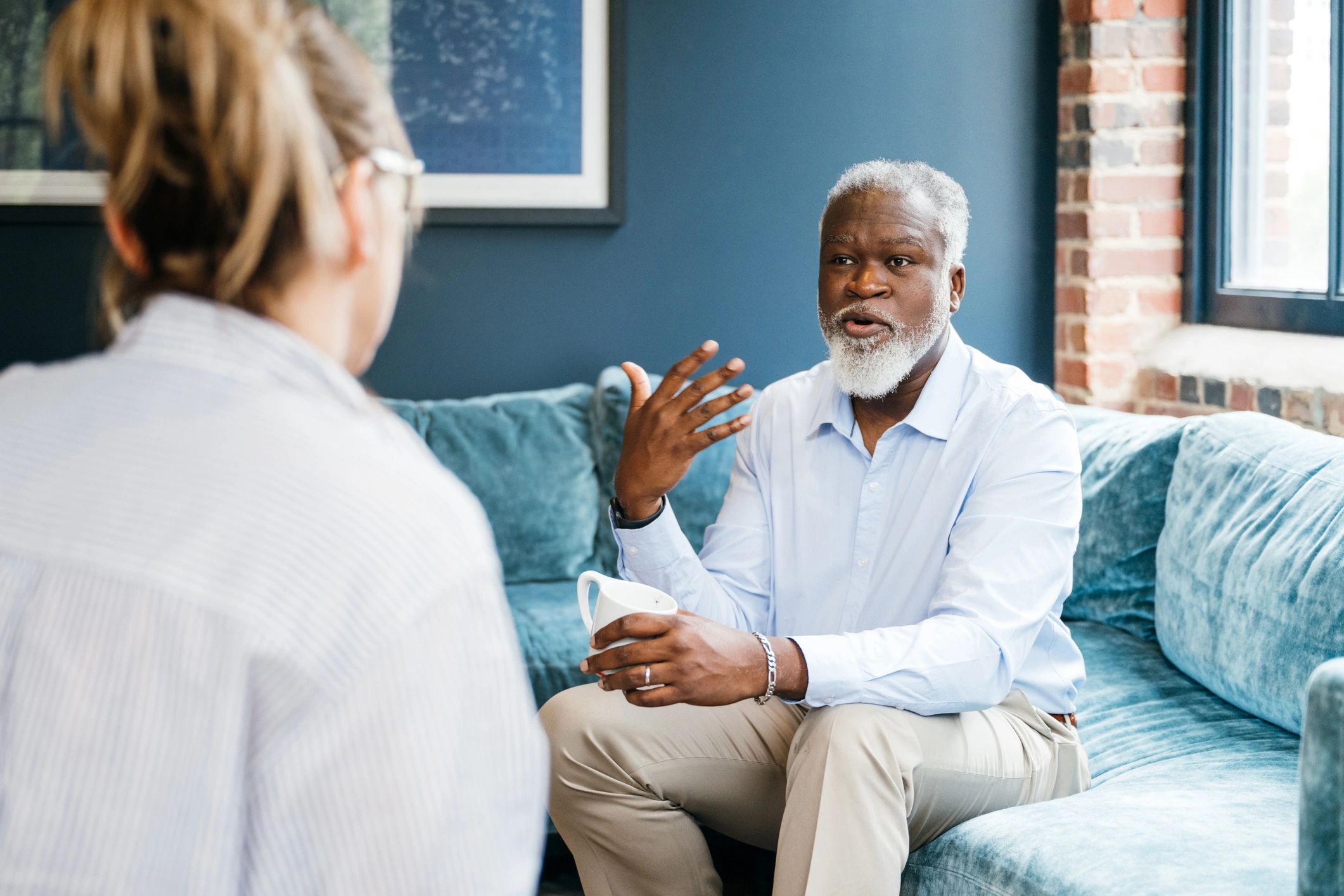 African American therapist supporting diverse client in a counseling session
